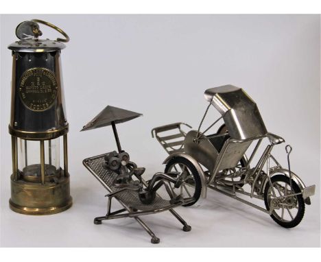 A brass and steel cased miner's lamp, bearing label for The Protector Lamp &amp; Lighting Co Ltd of Eccles, h.25cm (excluding