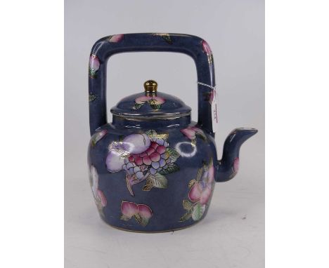 A Chinese blue glazed teapot, enamel decorated with cherries, height 25cm