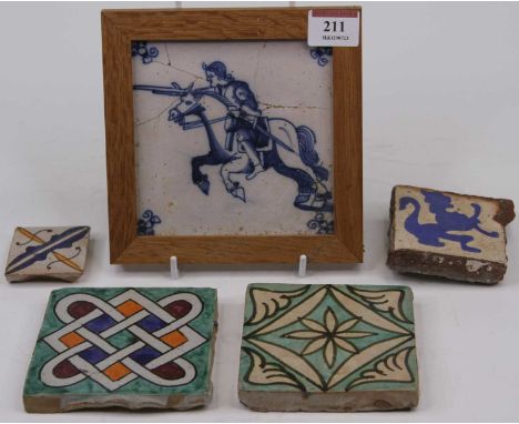 An 18th century Delft tile, decorated with a knight on horseback (a/f), together with four other earthenware tiles