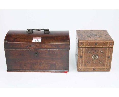 An early 19th century walnut tea caddy of cubic form, having geometric boxwood and pear wood stringing with ivory and copper 