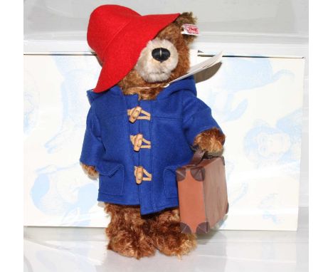 A Steiff Paddington bear soft toy with button to ear and white label numbered 664632 with further card tag, boxedIn very good