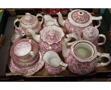 A box of Victorian lustre teawares to include teapots, cream jugs, cups and saucers, side plates etc (several areas of losses
