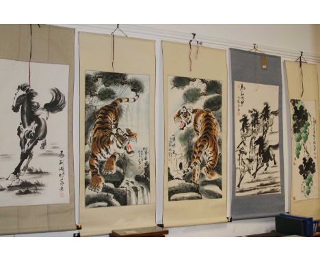 A Chinese silk scroll painting depicting a horse with script to bottom right and red seal mark, together with four others to 