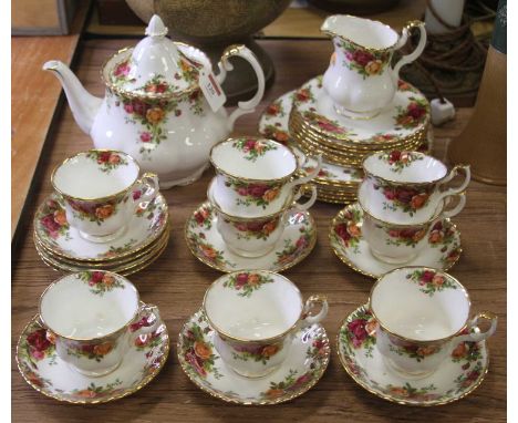 A Royal Albert eight-place setting tea service in the Old Country Roses patternTeapot is cracked.The rest of the service appe