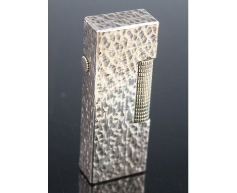A Dunhill textured white metal cased pocket pigarette lighter, USA ref. 24163