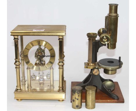 A 19th century brass monocular microscope by Baker of 244 High Holborn London, mounted on a wooden base, h.27cm, together wit
