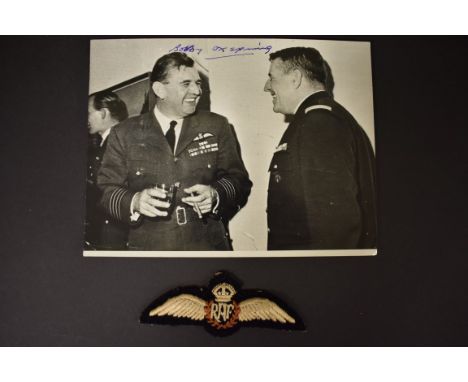 An autographed black and white photograph of Group Captain R W Oxspring DFC AFC, circa 1966, with related RAF cloth badge; an
