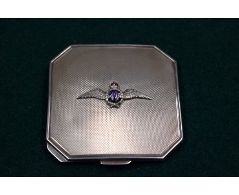 An engine turned silver compact, by William Neale Ltd, Birmingham 1939, having enamel RAF emblem, 70mm. 