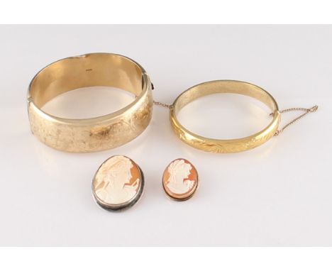 A lot to include a 9ct yellow gold hinged bangle, width approx. 24mm, the entire circumference engraved with repeat foliage s