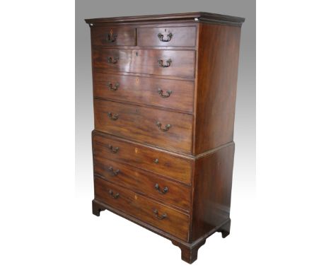 A 19th Century Georgian secretaire chest on chest, the top section having two short over two long drawers over cupboard drawe