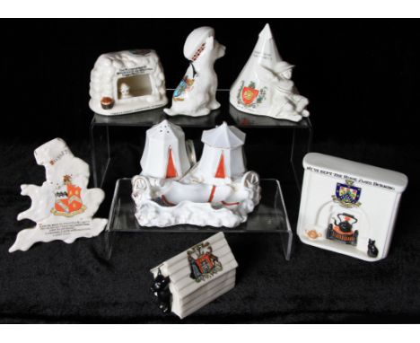 A group of seven WW1 military related Crested Ware items to include; fire place with black cat and motto 'We've kept the Home