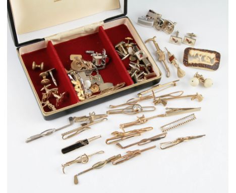 A large quantity of costume jewellery to include a collection of equestrian and sports related tie pins and cufflinks, beads,