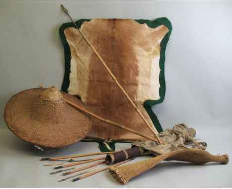 A native bushman's hunting set, purchased in Botswana, comprising spear, bow and arrows in hollowed out branch quiver and lea