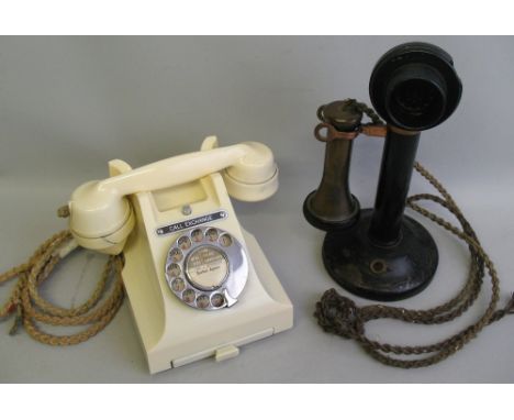 A GPO ivory bakelite turn-dial telephone, inscribed 312F.H54/3A, together with a candlestick telephone marked N4B FH34/1, 31c