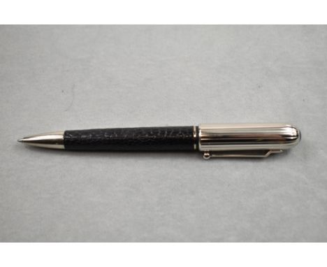 An Alfred Dunhill Ballpoint pen having leather encased barrel with ribbed silver cap, limited edition, number 1068/1893, with