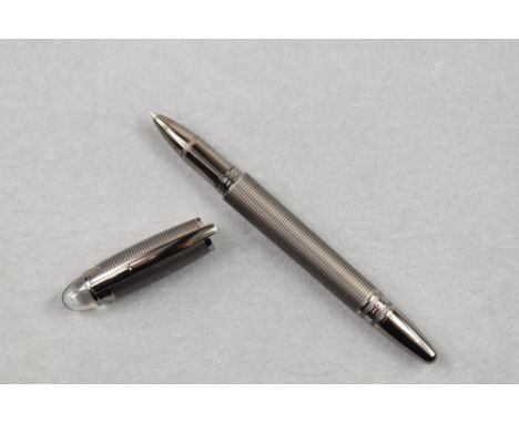A Montblanc rollerball pen. The Starwalker in a metalic grey hooped design. Number HU1621108 no box or leaflet