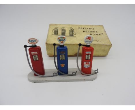 BRITAINS DIECAST PETROL PUMP SET  A set of three diecast petrol pumps, featuring Esso, Fina and Mobilgas. In good original co