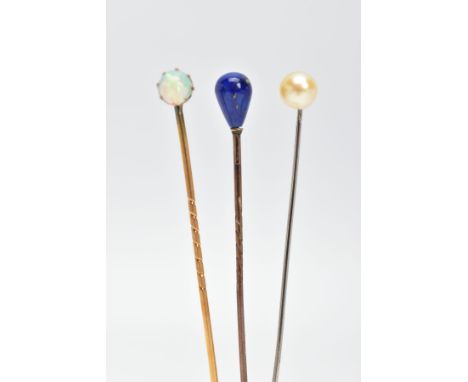 THREE GEMSET STICKPINS, to include one yellow metal stickpin set with a single claw set opal, a yellow metal stickpin set wit