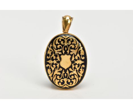 A VICTORIAN YELLOW METAL ENAMEL MOURNING  LOCKET, of an oval form, decorated with a foliate gold design within black enamel, 