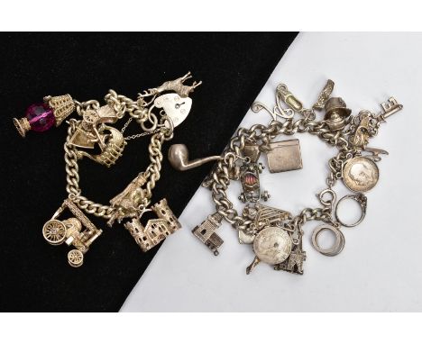 TWO SILVER CHARM BRACELETS, the first fitted with seven charms in forms such as a lamp, train, building, Viking boat, deer et