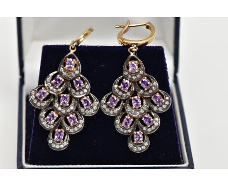 A PAIR OF SILVER GILT AMETHYST DROP EARRINGS, each drop of an openwork diamond shape, set with nine oval cut amethysts and co