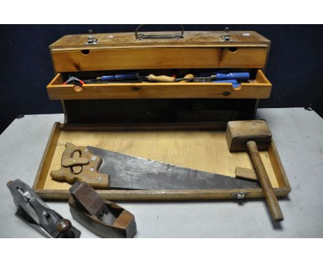 A VINTAGE WOODEN TOOLBOX containing a selection of woodworking tools chisels, hammer, planes etc