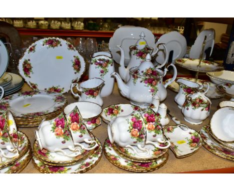 A  SIXTY ONE PIECE ROYAL ALBERT OLD COUNTRY ROSES TEA SET, comprising a coffee pot, a teapot (chip and crack to spout), a cak