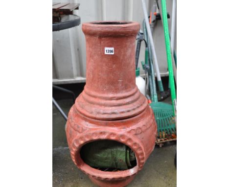 A SMALL CERAMIC CHIMINEA 75cm high