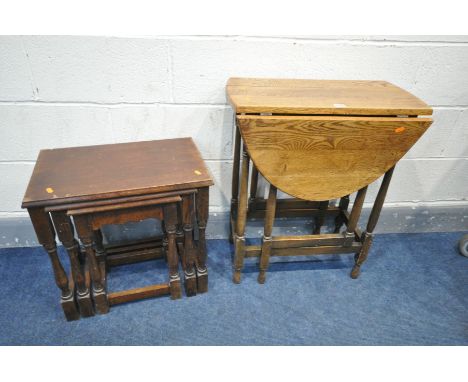 AN OAK OVAL TOP GATE LEG TABLE, open length 87cm x depth 35cm x height 72cm (condition:-crack to top) and an oak nest of thre