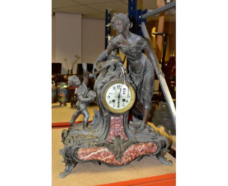 A SPELTER AND VARIGATED MARBLE DRUM HEAD MANTLE CLOCK, the Uranium glass dial having Arabic numerals, the movement is signed 