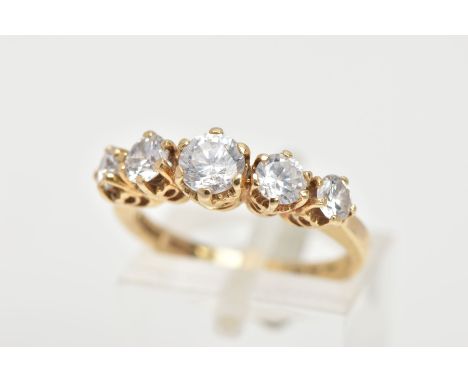 A 14CT GOLD FIVE STONE RING, designed with a row of claw set, graduated colourless cubic zirconia, to a plain polished band, 