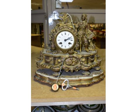 A MID 19TH CENTURY FRENCH GILT METAL FIGURAL MANTEL CLOCK, cast with a late 17th century style gentleman standing beside the 