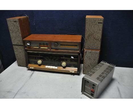 A QUAD 33 PRE AMP, a FM 3 tuner both in a bespoke afromosia cabinet, a Quad 303 power amplifier, four Goodmans Maxim bookshel