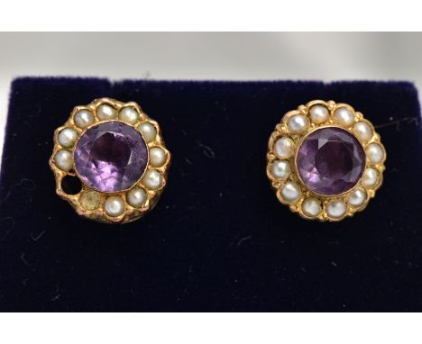 A PAIR OF YELLOW METAL AMETHYST AND SEED PEARL EARRINGS, each of a circular form, centring on a circular cut amethyst within 