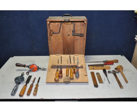 A BESPOKE WOODEN TOOLBOX containing various woodworking tools, saws, chisels, screwdrivers, manual hand drills etc
