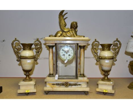 AN EARLY 20TH CENTURY ONYX AND GILT METAL CLOCK GARNITURE, the clock with winged sphinx surmount above a rectangular architec