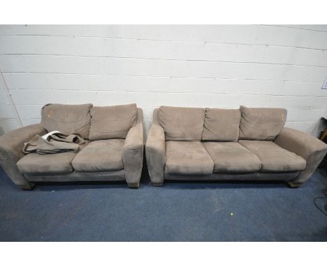 A LIGHT BROWN SUADE UPHOLSTERED TWO PIECE SUITE, comprising a three seater settee, and a two seater settee (condition:-some s