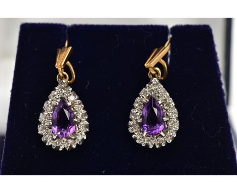 A PAIR OF AMETHYST AND DIAMOND CLUSTER DROP EARRINGS, each designed as a pear shape cluster, the central pear shape amethyst 