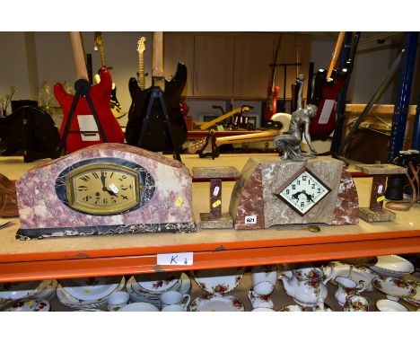 A FRENCH ART DECO CLOCK GARNITURE, the marble case surmounted with a cast metal figure of a female holding a ball aloft, the 