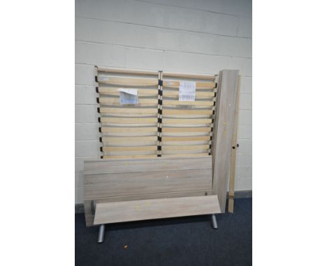 A LIGHT WOOD EFFECT 5FT BEDSTEAD, with two slatted bases