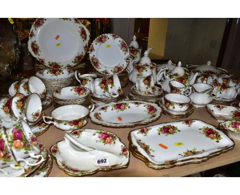 A ROYAL ALBERT OLD COUNTRY ROSES PATTERN DINNER SERVICE, comprising two twin handled circular tureens and covers (one has lay