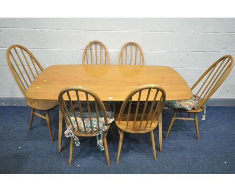 AN ERCOL MODEL 382 BEECH AND ASH RECTANGULAR TABLE, width 153cm x depth 78cm x height 74cm with a set of six quaker back chai