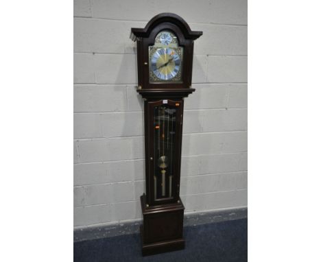 A MODERN MAHOGANY LONGCASE CLOCK, the arched glazed hood enclosing an eight inch dial,   tempus fugit   inscribed to top, hei