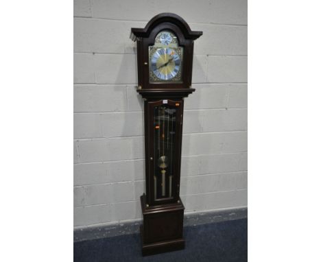 A MODERN MAHOGANY LONGCASE CLOCK, the arched glazed hood enclosing an eight inch dial,   tempus fugit   inscribed to top, hei