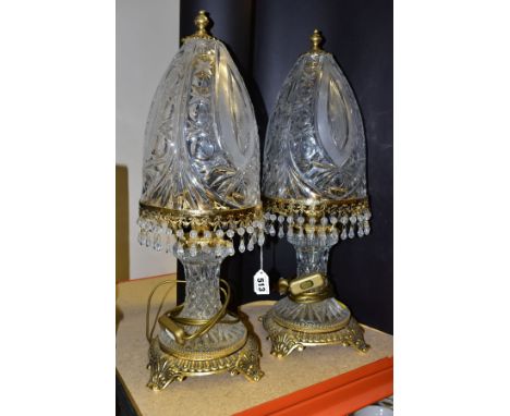 A PAIR OF KLEIN BACCARAT CRYSTAL TABLE LAMPS, with a diamond cut crystal body on a brass base, elongated bell shaped shades w