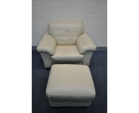 A CREAM LEATHER ARMCHAIR, and a matching ottoman pouffe (2)