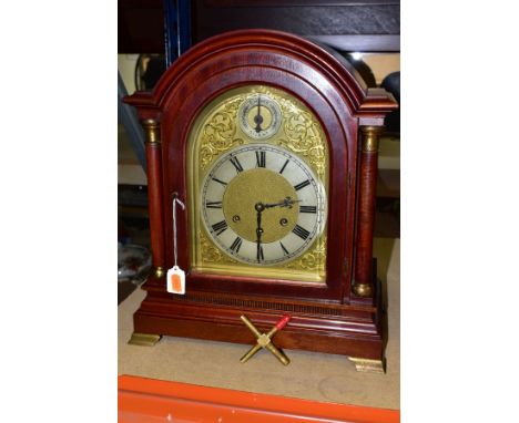 AN EARLY 20TH CENTURY MAHOGANY CASED BRACKET CLOCK, arched pediment on Doric columns flanking the bevelled glass door enclosi