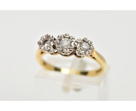AN 18CT GOLD THREE STONE DIAMOND RING, the three graduated diamonds in illusion settings, leading on to a polished yellow gol