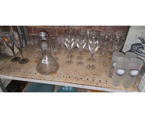 SHELF OF MISC DRINKING GLASSES & A DECANTER