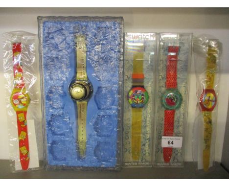 Two cased Swatch Scuba 200 wristwatches, together with two Wesco Simpson watches and a Happy Holidays Swatch watch 